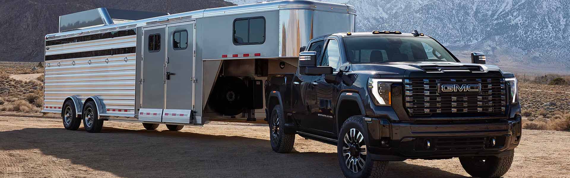 All new 2026 GMC Sierra 2500 HD parked near mountain